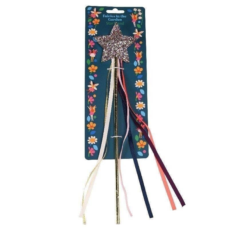 Star-shaped wand with colorful ribbons on a decorative card with fairy designs.