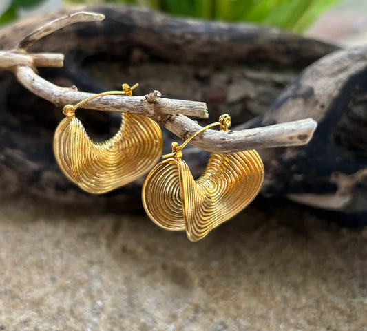 18ct Gold Plated Saddle Hoop Earrings hung on driftwood