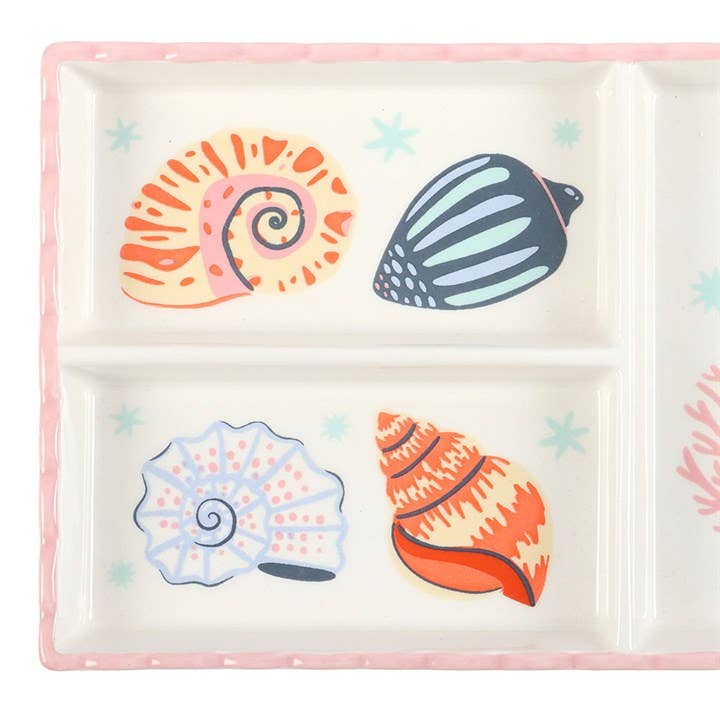 Divided plate with colorful shell designs on a white background