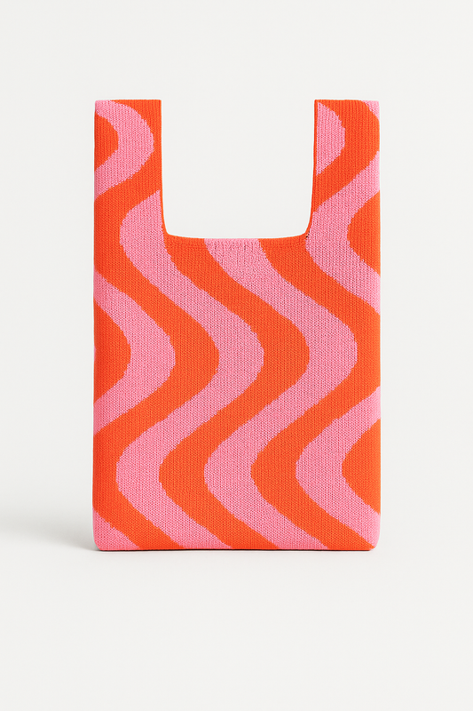 Woven bag with pink and orange wavy pattern on a white background