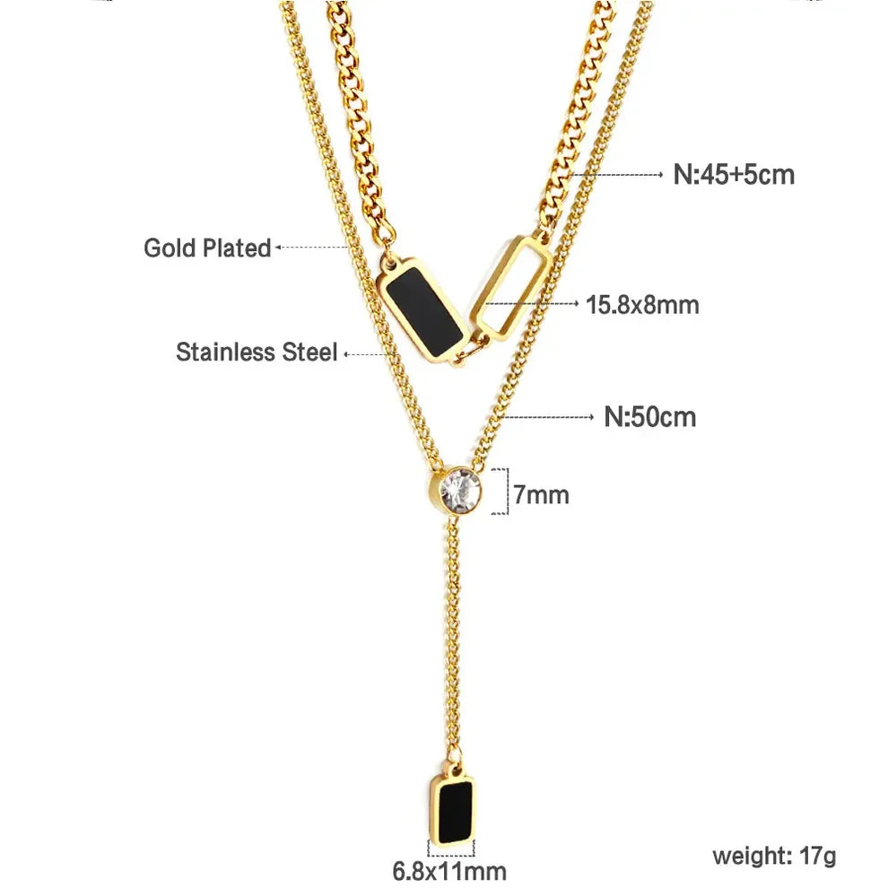 Gold-plated double-layered Y-shaped necklace with black rectangular inlays, a central clear rhinestone, and dimension labels on a white background.