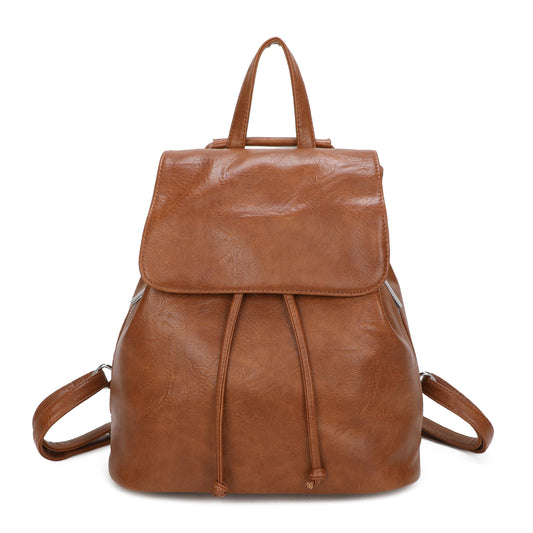 Brown leather backpack on a white background
