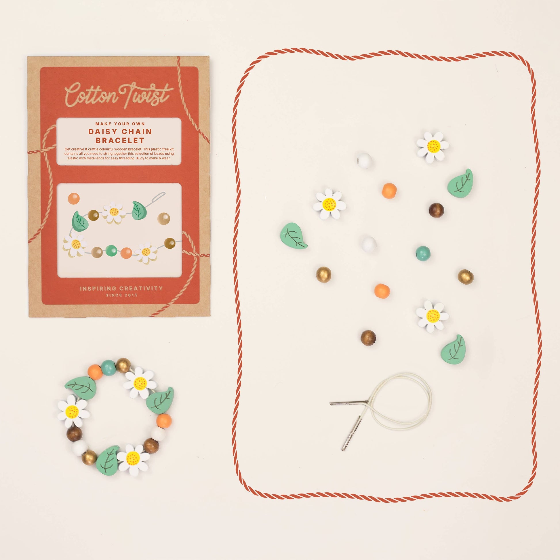 Cotton Twist daisy chain bracelet kit with packaging and materials on a beige background