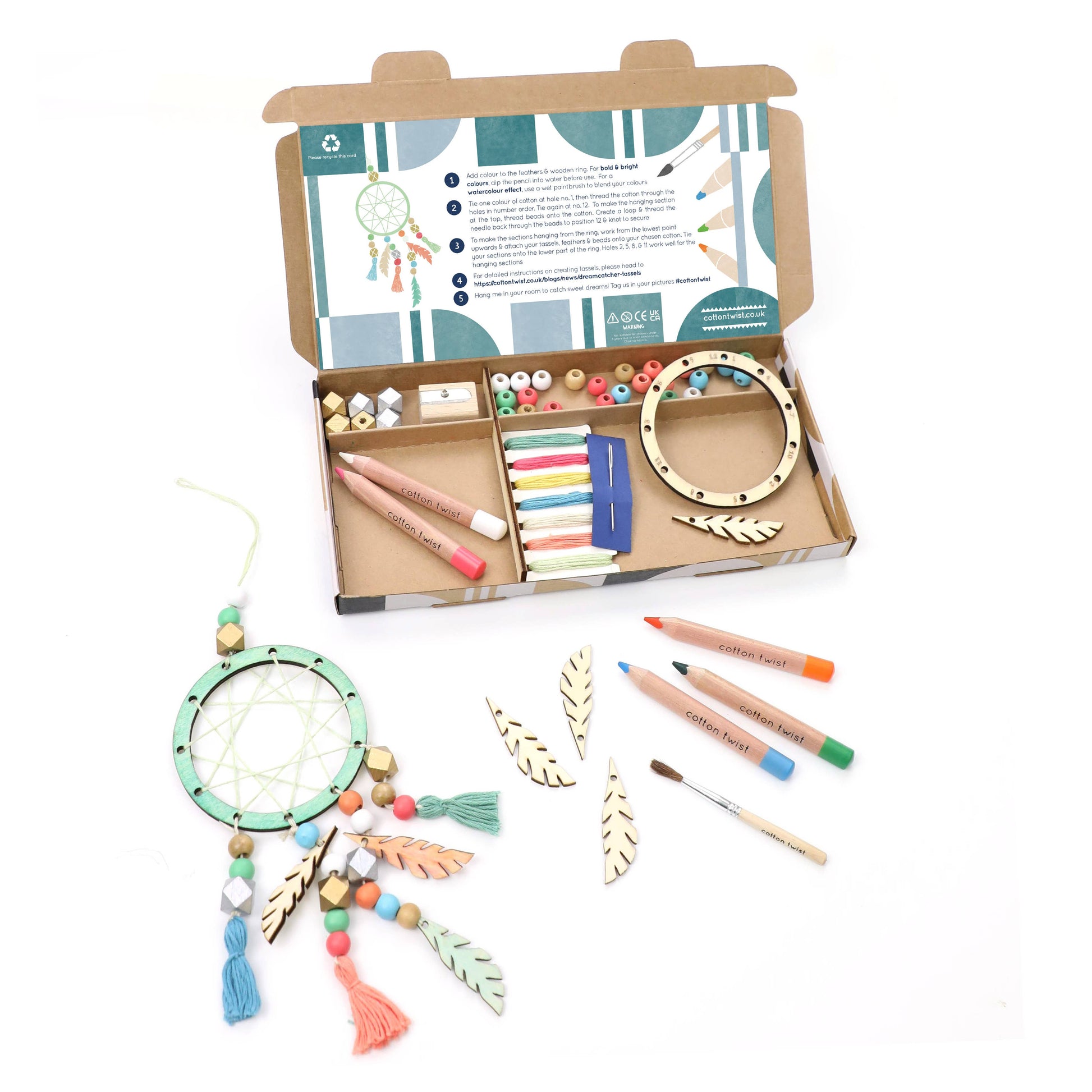 Craft kit with materials for making a dreamcatcher on a white background