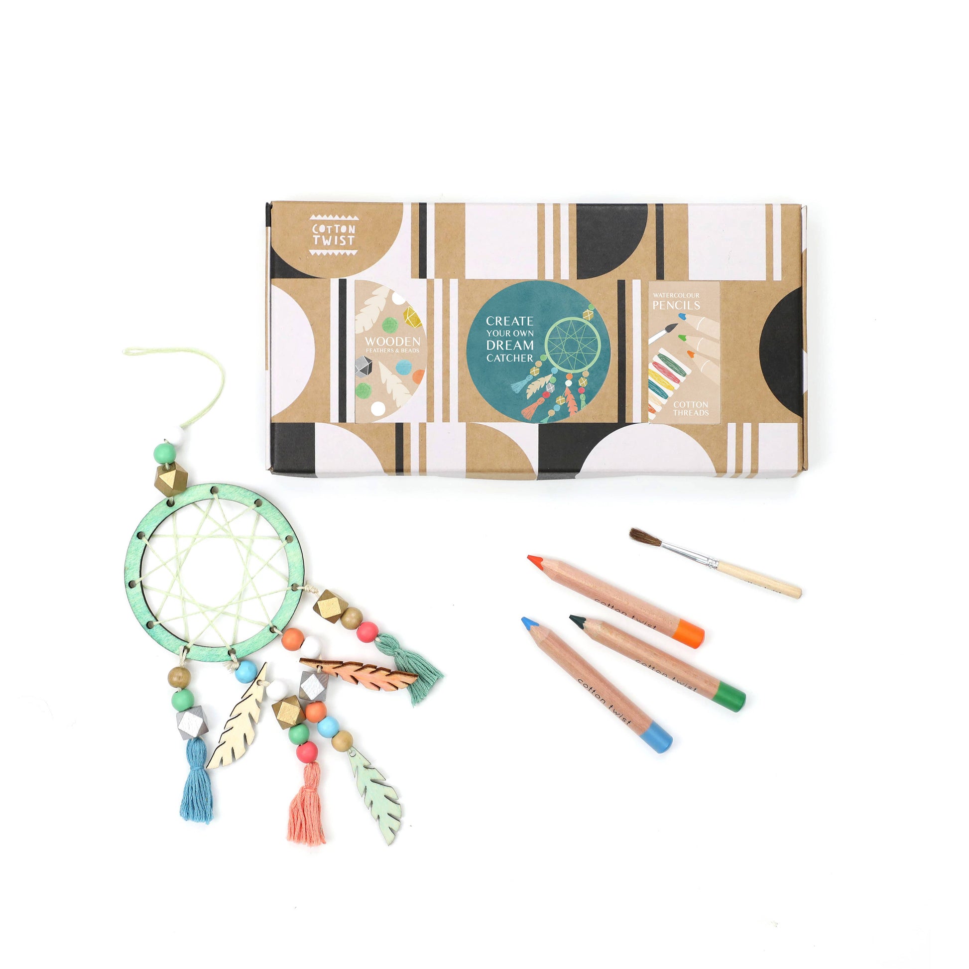 Dream catcher kit with packaging, feathers, and colored pencils on a white background