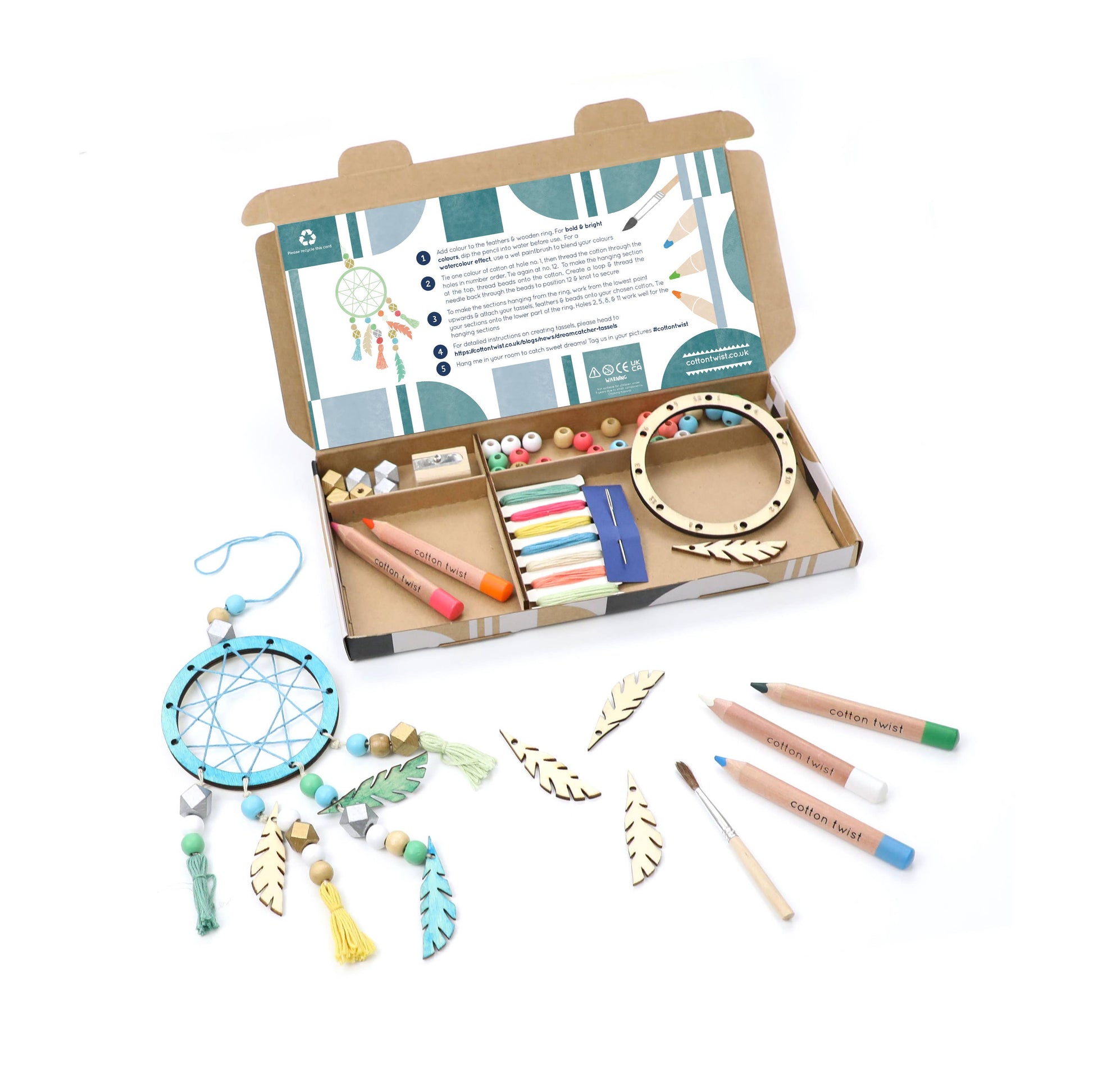 Craft kit with materials for making a dreamcatcher on a white background