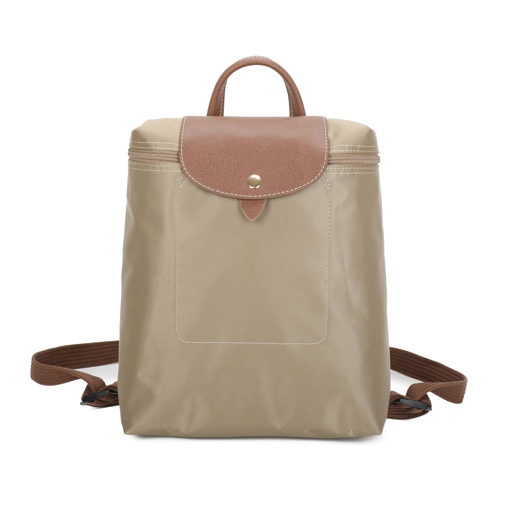 A beige nylon backpack with a brown leather flap and top handle, featuring a front pocket and adjustable shoulder straps, shown against a plain white background.