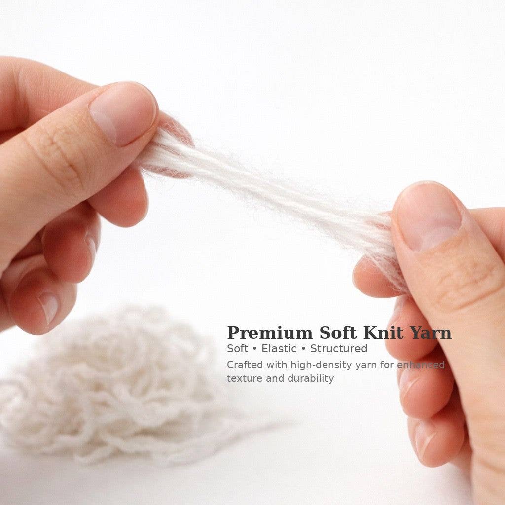 Hands holding white yarn with text about premium soft knit yarn on a white background