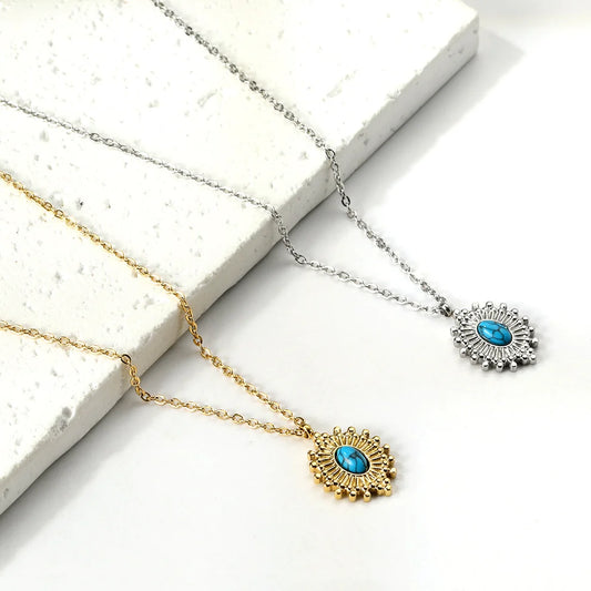 Two necklaces with turquoise pendants on a white surface